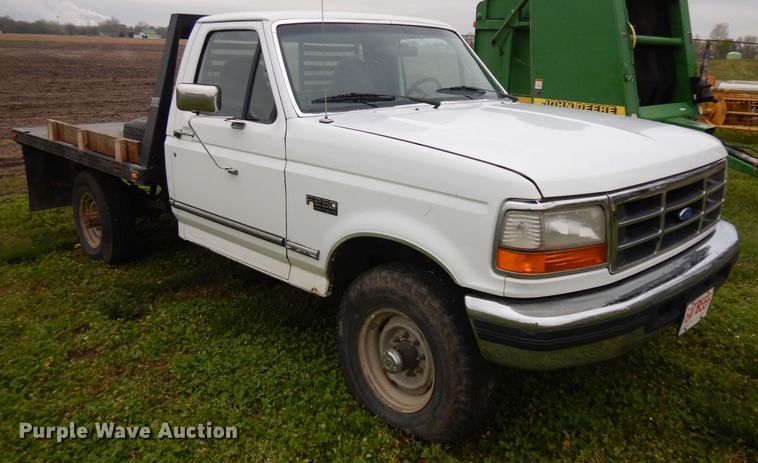 image for item GY9054 1997 Ford F250  flatbed pickup truck