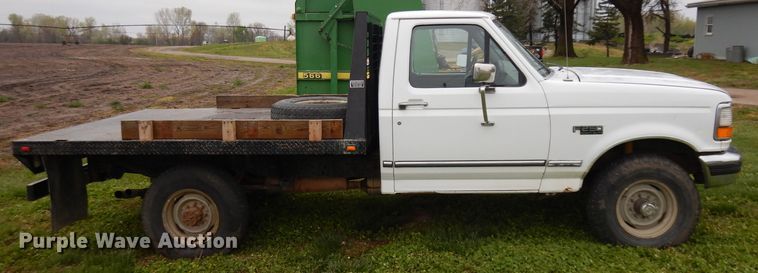 image for item GY9054 1997 Ford F250  flatbed pickup truck