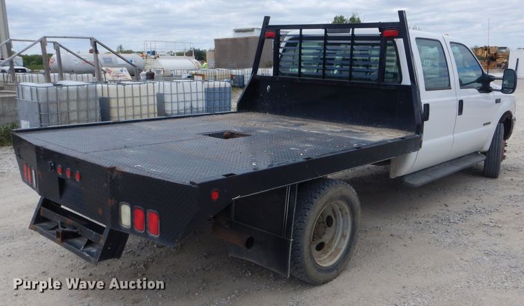 image for item DF3161 2001 Ford F550 Super Duty XL Crew Cab flatbed truck