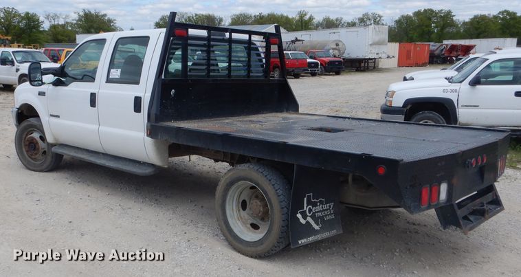 image for item DF3161 2001 Ford F550 Super Duty XL Crew Cab flatbed truck