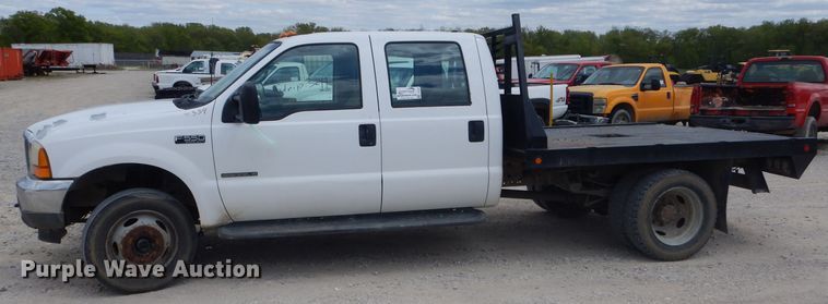 image for item DF3161 2001 Ford F550 Super Duty XL Crew Cab flatbed truck