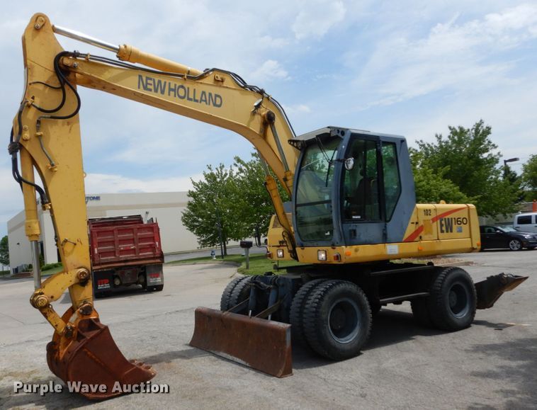image for item GV9013 2000 New Holland EW160  rubber tire excavator