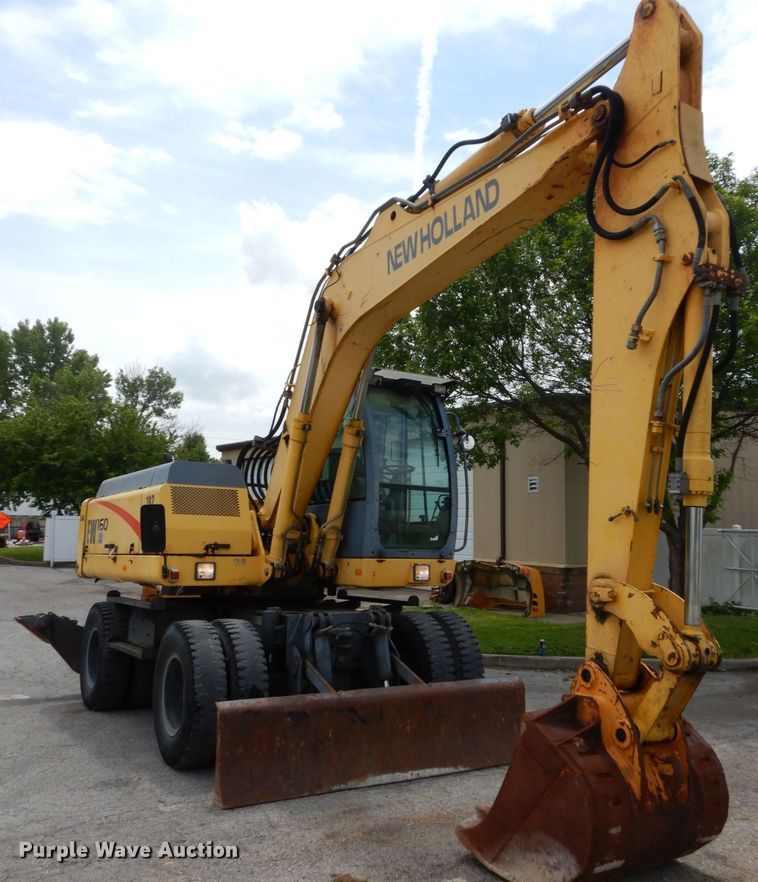 image for item GV9013 2000 New Holland EW160  rubber tire excavator