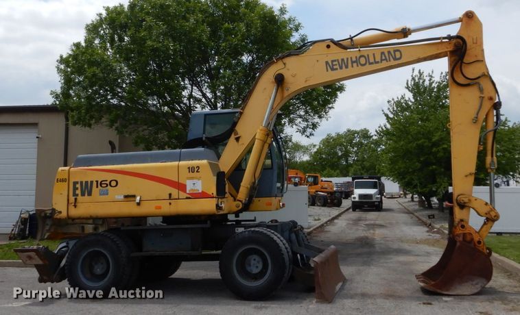 image for item GV9013 2000 New Holland EW160  rubber tire excavator