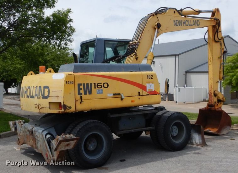 image for item GV9013 2000 New Holland EW160  rubber tire excavator