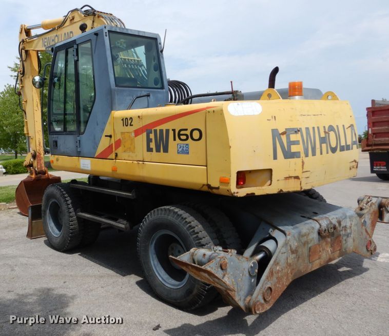 image for item GV9013 2000 New Holland EW160  rubber tire excavator