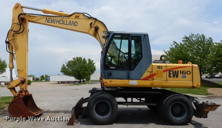 image for item GV9013 2000 New Holland EW160  rubber tire excavator