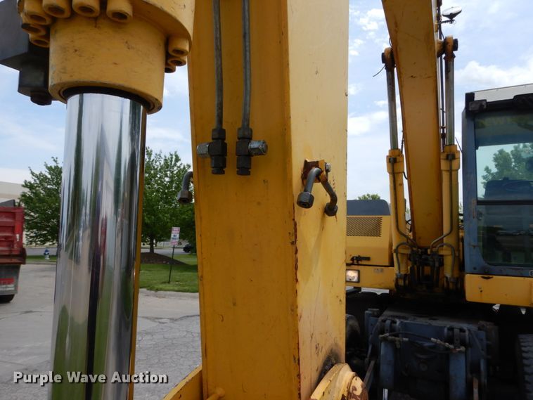 image for item GV9013 2000 New Holland EW160  rubber tire excavator