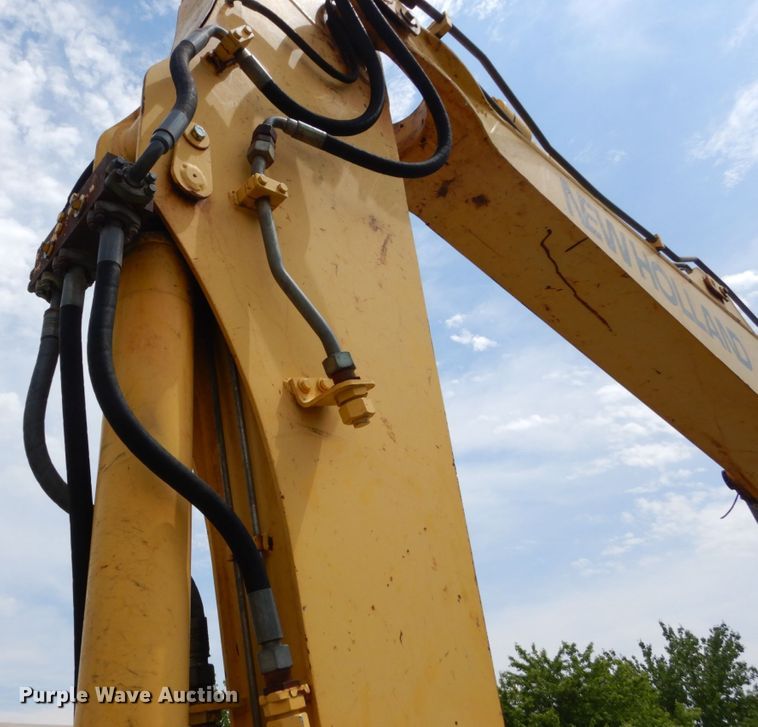 image for item GV9013 2000 New Holland EW160  rubber tire excavator