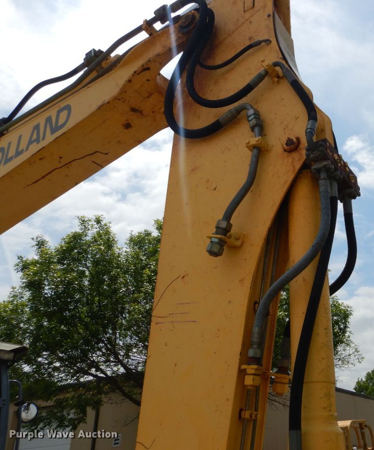 image for item GV9013 2000 New Holland EW160  rubber tire excavator