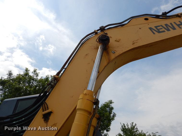 image for item GV9013 2000 New Holland EW160  rubber tire excavator