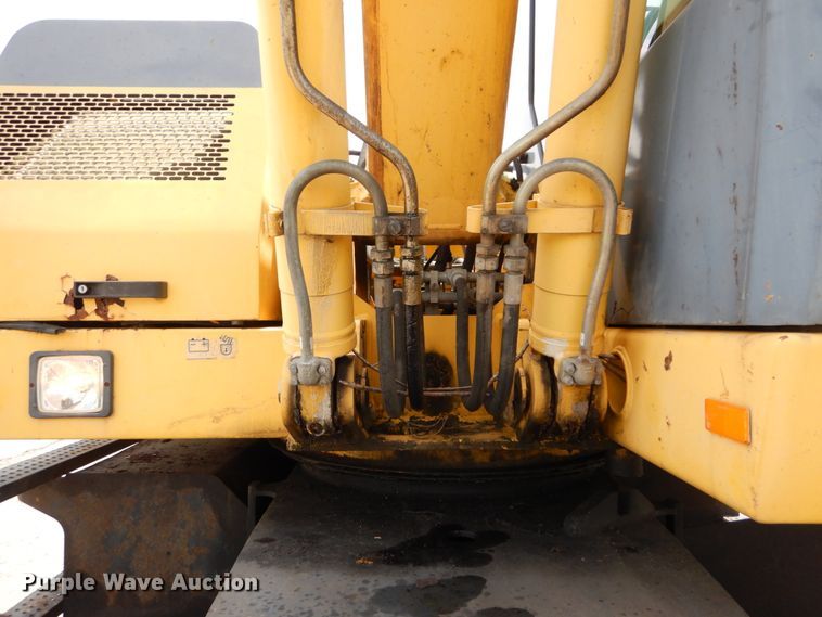 image for item GV9013 2000 New Holland EW160  rubber tire excavator