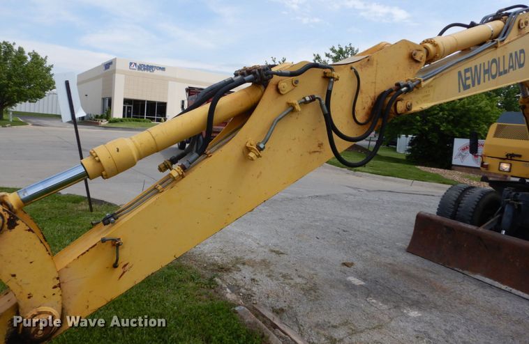 image for item GV9013 2000 New Holland EW160  rubber tire excavator