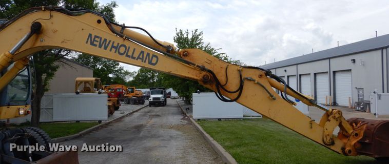 image for item GV9013 2000 New Holland EW160  rubber tire excavator