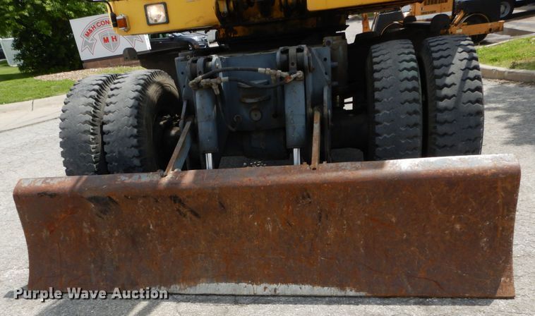 image for item GV9013 2000 New Holland EW160  rubber tire excavator