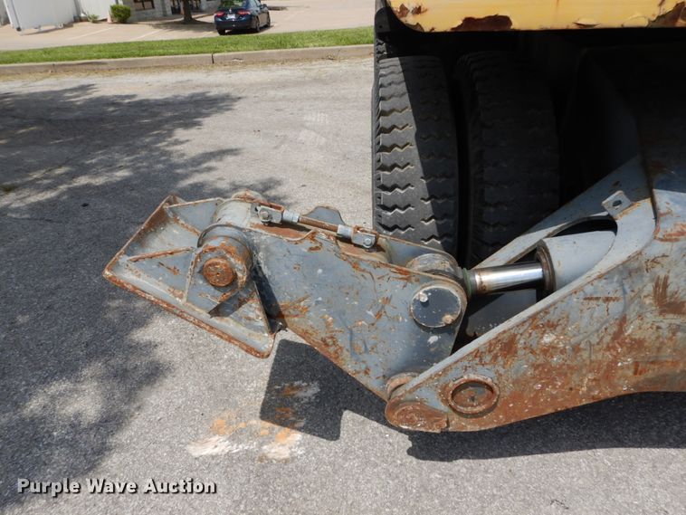 image for item GV9013 2000 New Holland EW160  rubber tire excavator