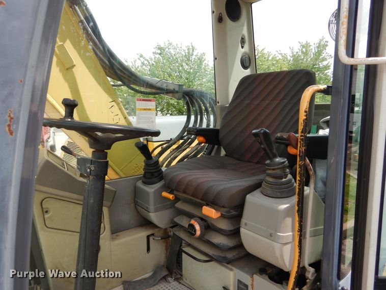 image for item GV9013 2000 New Holland EW160  rubber tire excavator