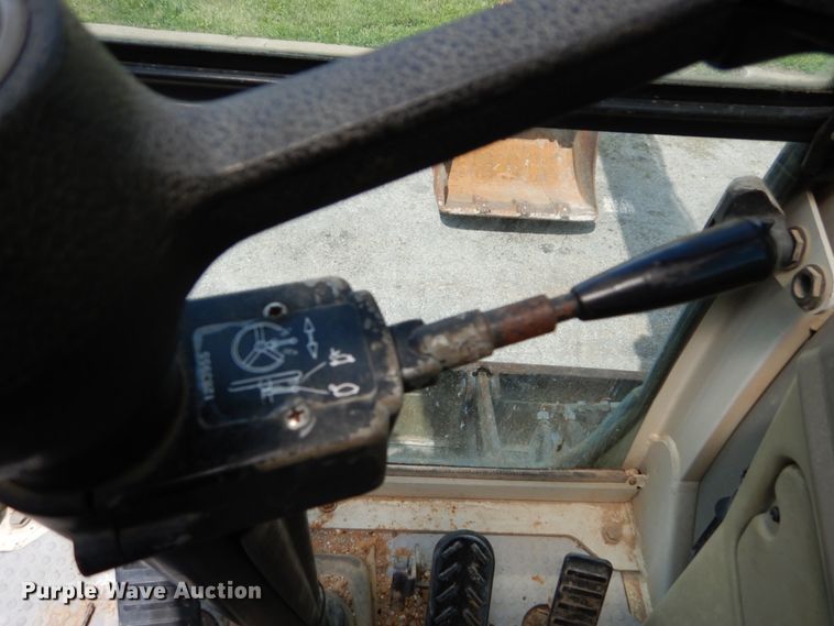 image for item GV9013 2000 New Holland EW160  rubber tire excavator