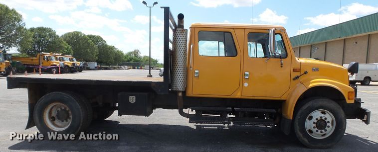 image for item DH7937 2002 International 4900 Crew Cab flatbed truck