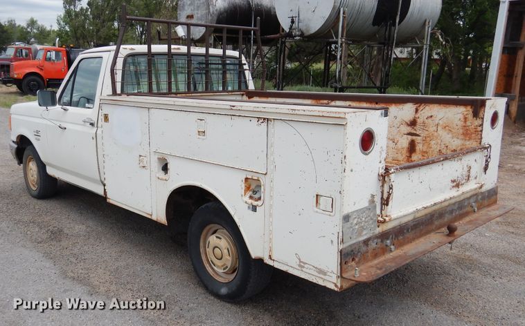 image for item GE9412 1987 Ford F150  utility bed pickup truck