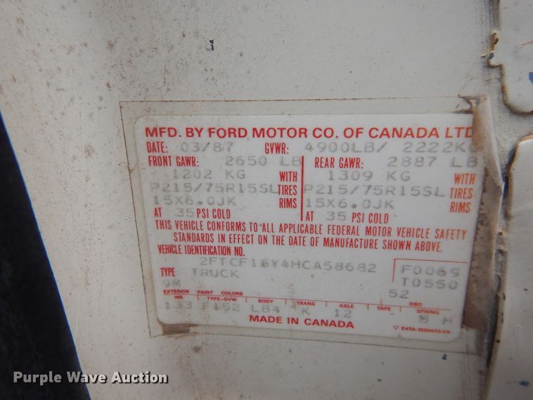 image for item GE9412 1987 Ford F150  utility bed pickup truck