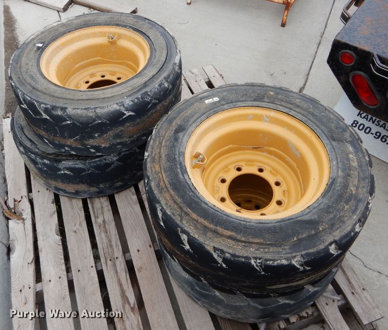 image for item GW9110 (4) Caterpillar 10-16.5 wheels and tires