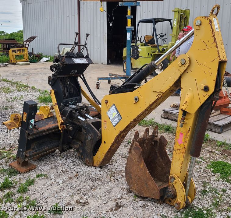 Caterpillar BH30 skid steer backhoe in Richmond, MO Item K5882 sold