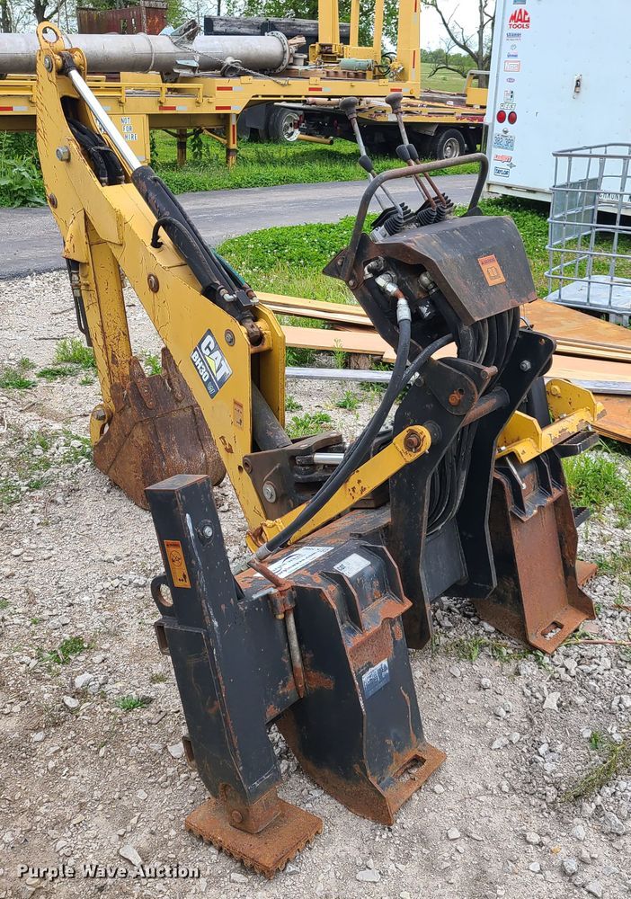 Caterpillar BH30 skid steer backhoe in Richmond, MO Item K5882 sold
