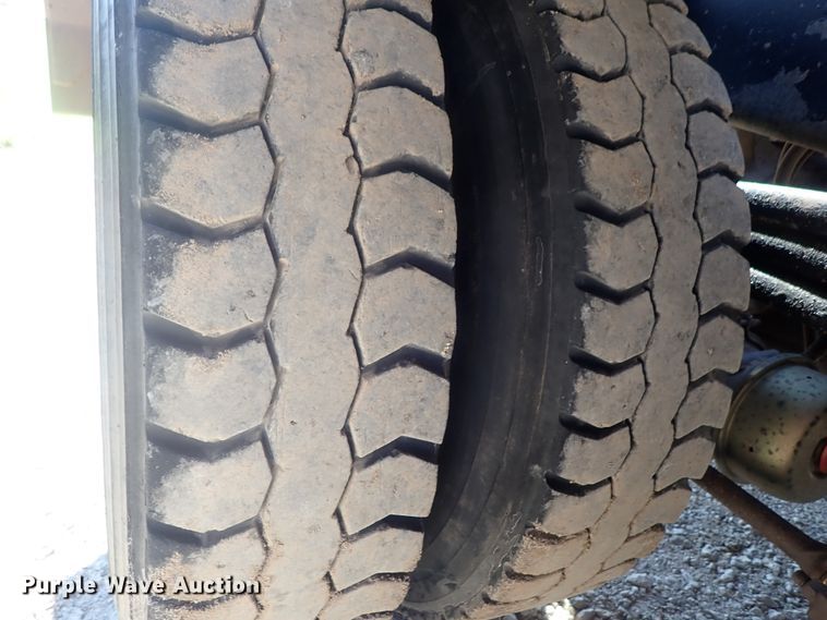 image for item DG2204 2009 Freightliner Business Class M2  roll-off container truck