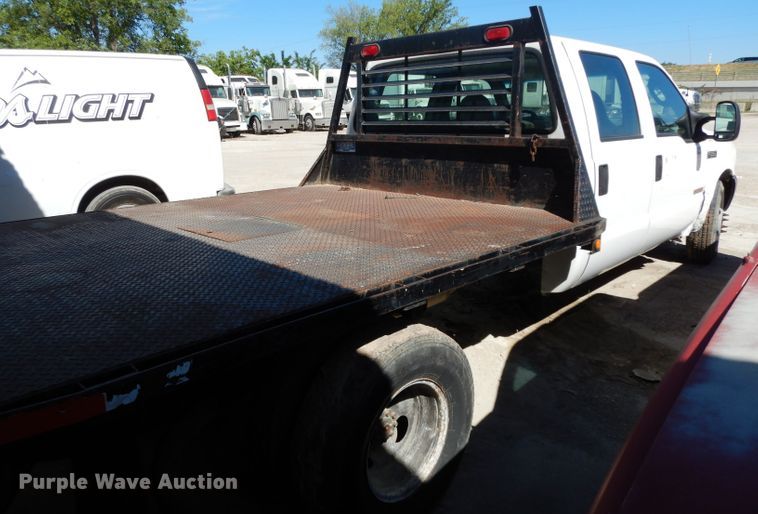 image for item DG6796 2004 Ford F350 Super Duty  Crew Cab flatbed pickup truck