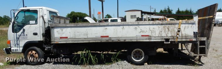 image for item DG6801 1999 Isuzu NPR  flatbed truck