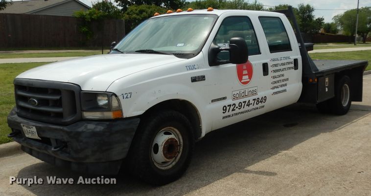 image for item DG6805 2002 Ford F350 Super Duty  Crew Cab flatbed pickup truck