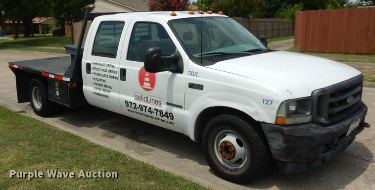 image for item DG6805 2002 Ford F350 Super Duty  Crew Cab flatbed pickup truck