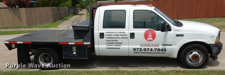 image for item DG6805 2002 Ford F350 Super Duty  Crew Cab flatbed pickup truck