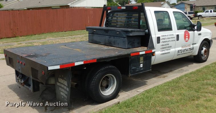 image for item DG6805 2002 Ford F350 Super Duty  Crew Cab flatbed pickup truck