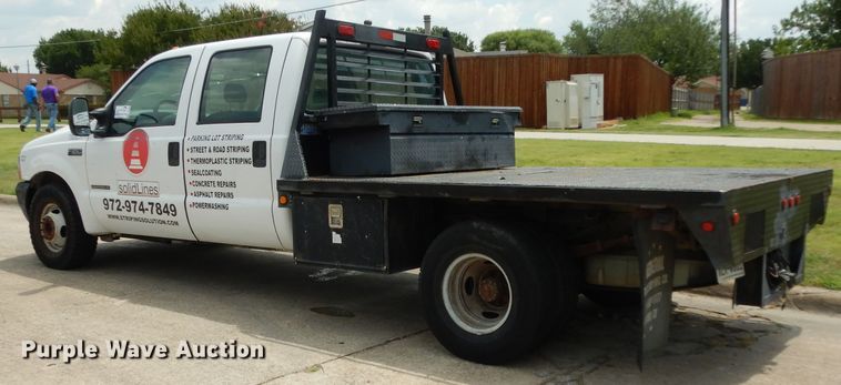 image for item DG6805 2002 Ford F350 Super Duty  Crew Cab flatbed pickup truck
