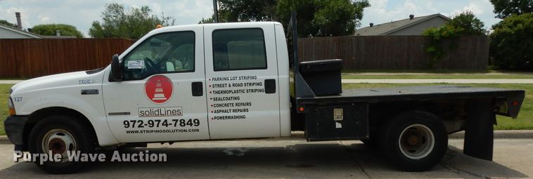 image for item DG6805 2002 Ford F350 Super Duty  Crew Cab flatbed pickup truck