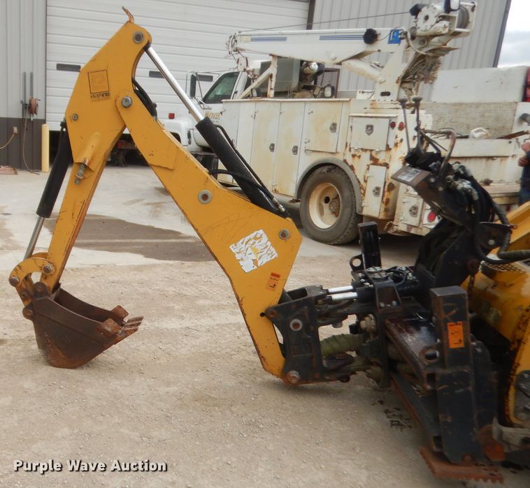 image for item GN9452 2002 Caterpillar BH-30W skid steer backhoe attachment