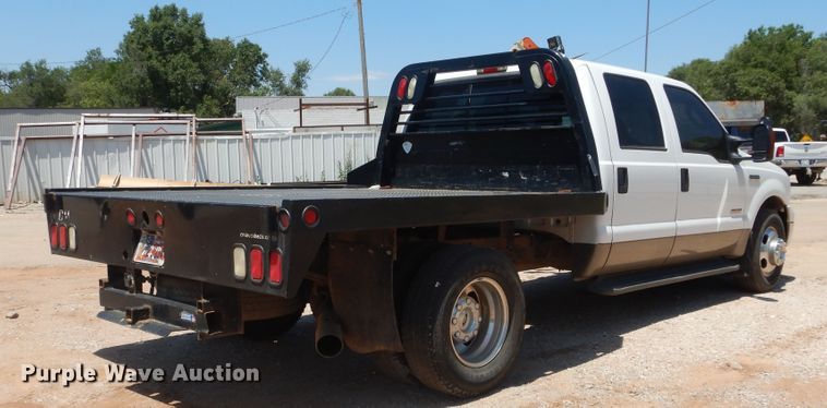 image for item HS9691 2005 Ford F350 Super Duty  Crew Cab flatbed pickup truck
