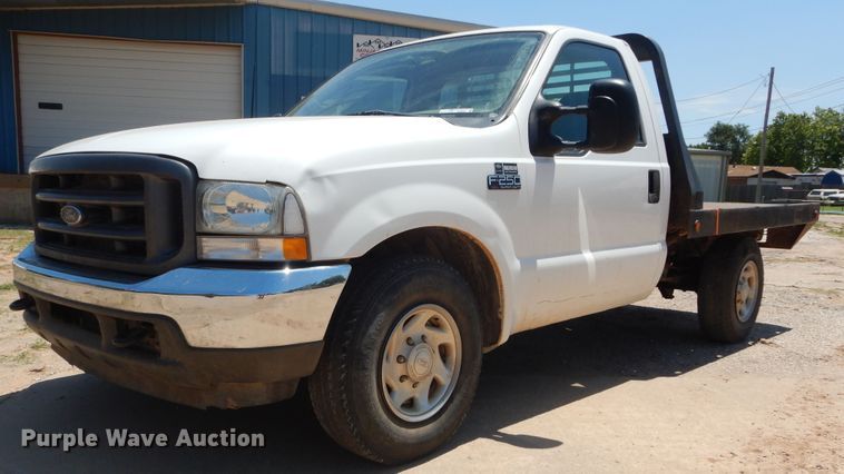 image for item HS9694 2003 Ford F250 Super Duty  flatbed pickup truck