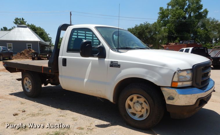 image for item HS9694 2003 Ford F250 Super Duty  flatbed pickup truck