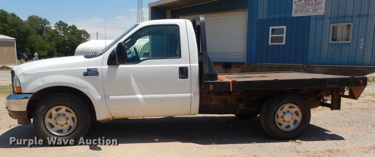 image for item HS9694 2003 Ford F250 Super Duty  flatbed pickup truck