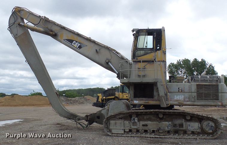 image for item DG5717 1999 Caterpillar 345B  material handler hydraulic excavator