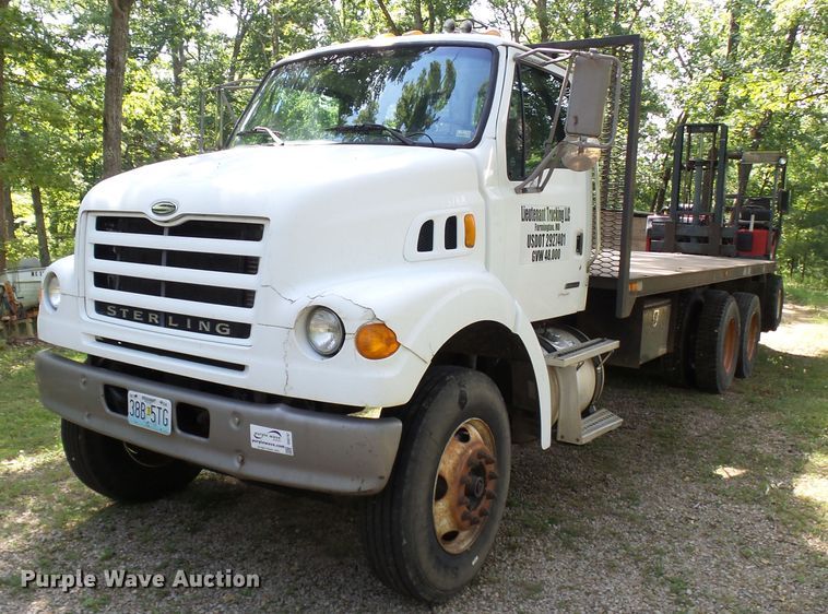 image for item DH3797 2004 Sterling L-Line  flatbed truck with forklift