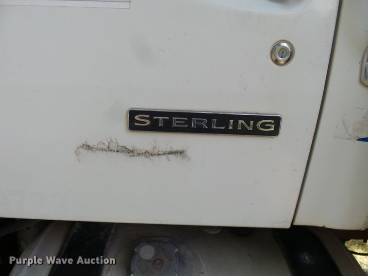 image for item DH3797 2004 Sterling L-Line  flatbed truck with forklift