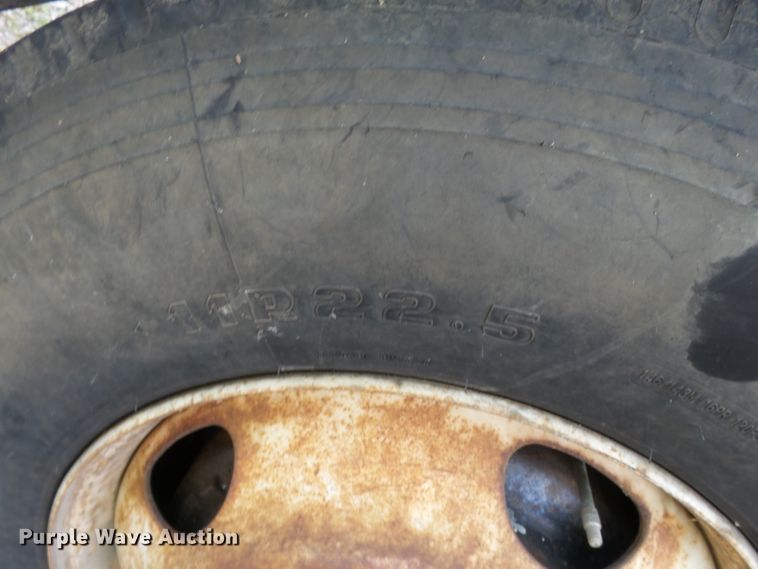 image for item DH3797 2004 Sterling L-Line  flatbed truck with forklift