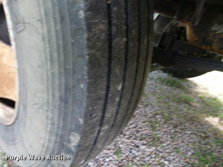 image for item DH3797 2004 Sterling L-Line  flatbed truck with forklift