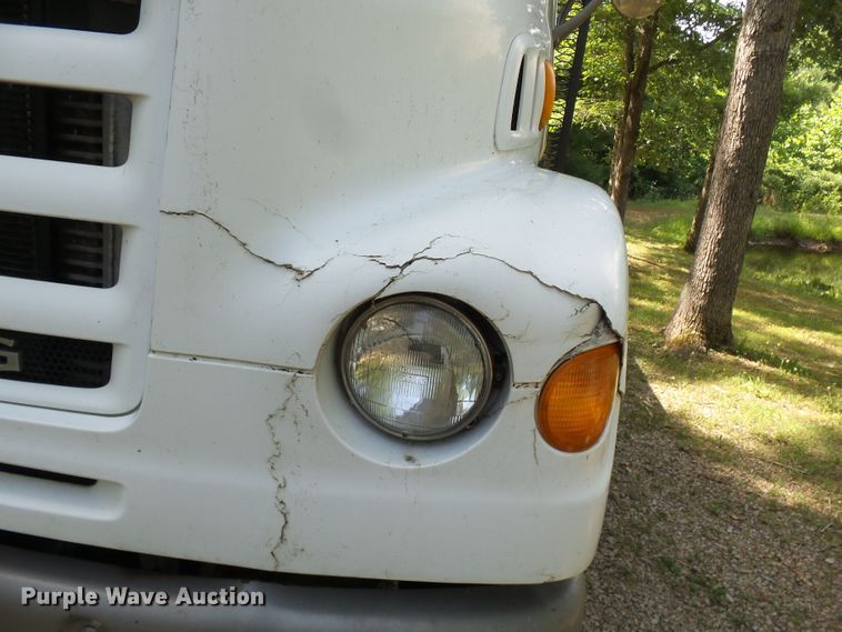 image for item DH3797 2004 Sterling L-Line  flatbed truck with forklift