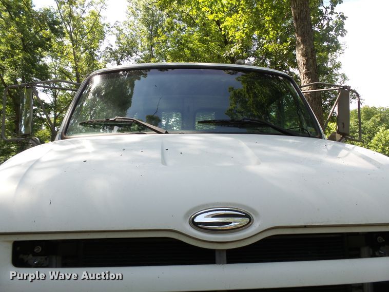 image for item DH3797 2004 Sterling L-Line  flatbed truck with forklift