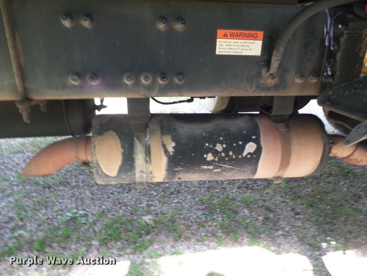 image for item DH3797 2004 Sterling L-Line  flatbed truck with forklift